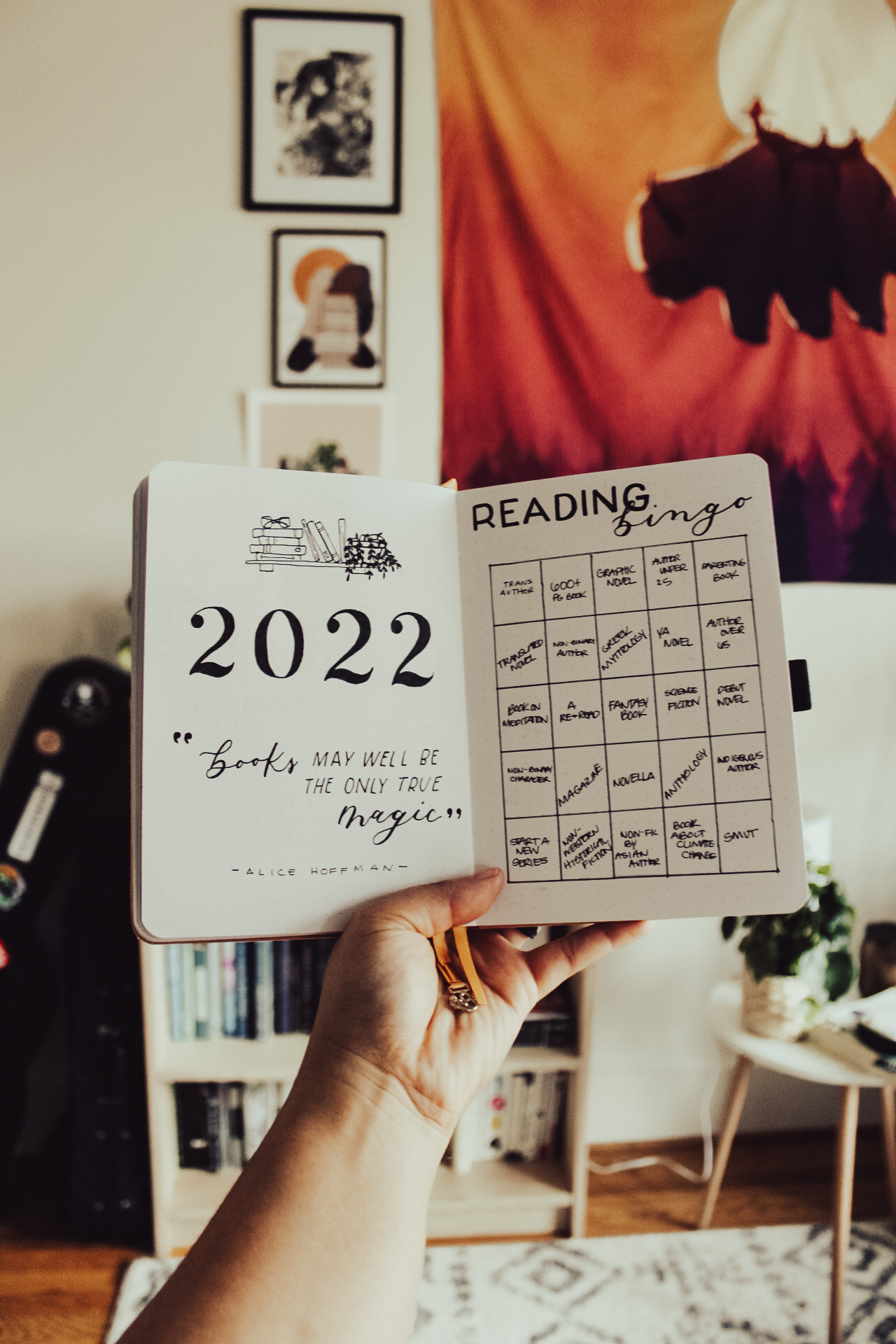 Reading journal spreads with a 2022 bullet journal cover page and book bingo spread.