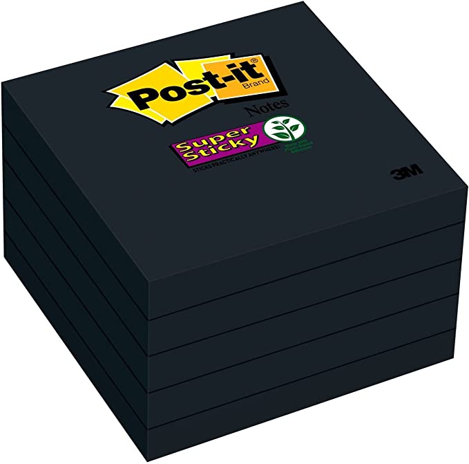 A pad of black post-it notes.