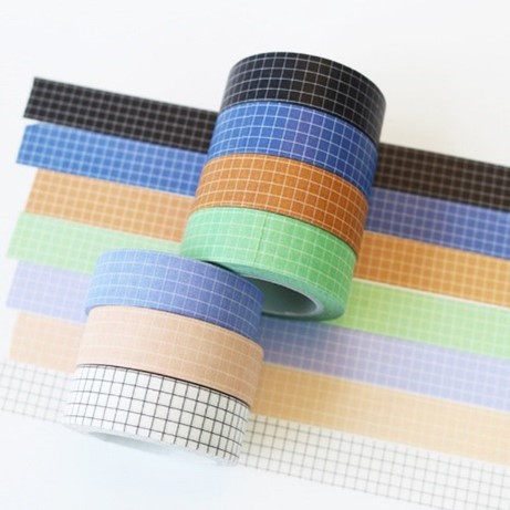 Several rolls of grid washi tape in varying colors.